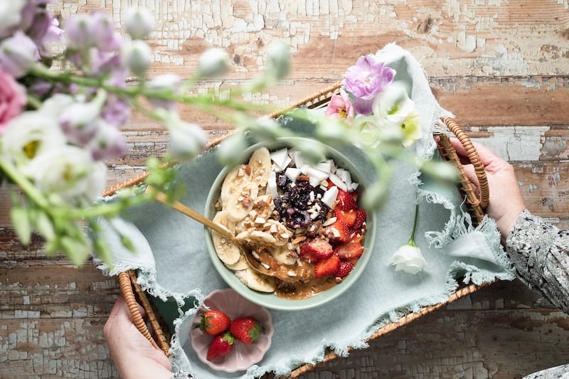 hormone balancing breakfast of greek yogurt with granola and berries