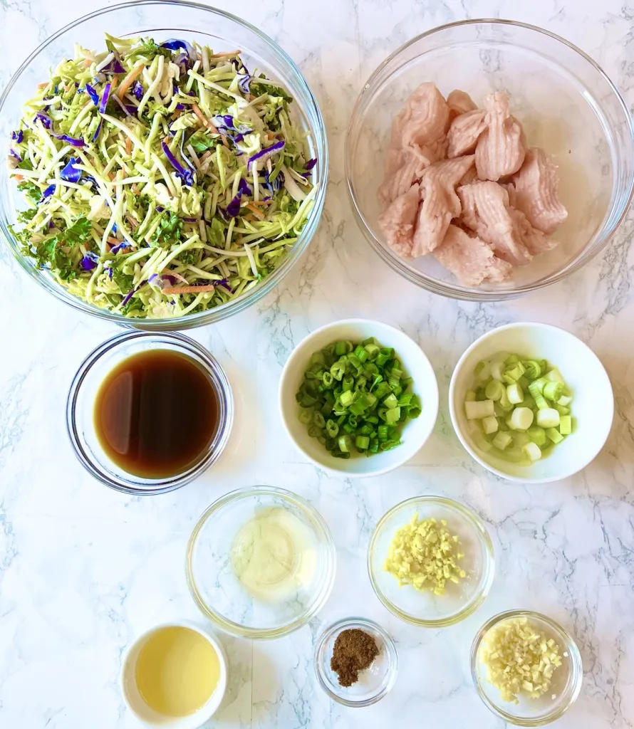 The ingredients for lean and green egg roll in a. bowl on a white table 