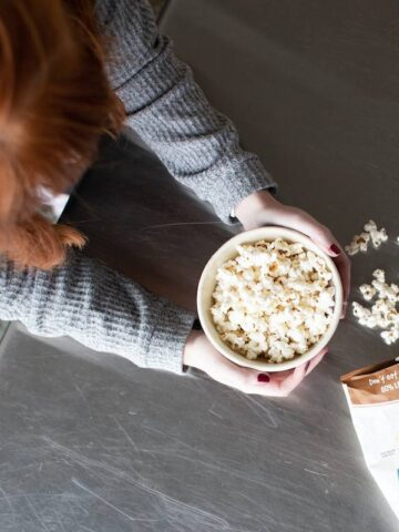 A birdseye view of a woman eating popcorn