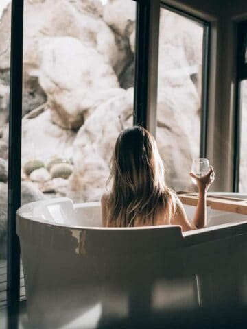 A woman taking a bath on self care sunday