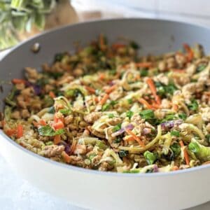 egg roll in a bowl in a skillet 45 degree angle view.