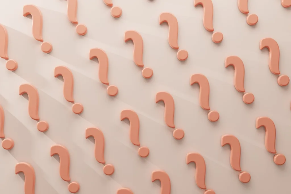 Question marks on a pink background representing the confusion around nutrition trends
