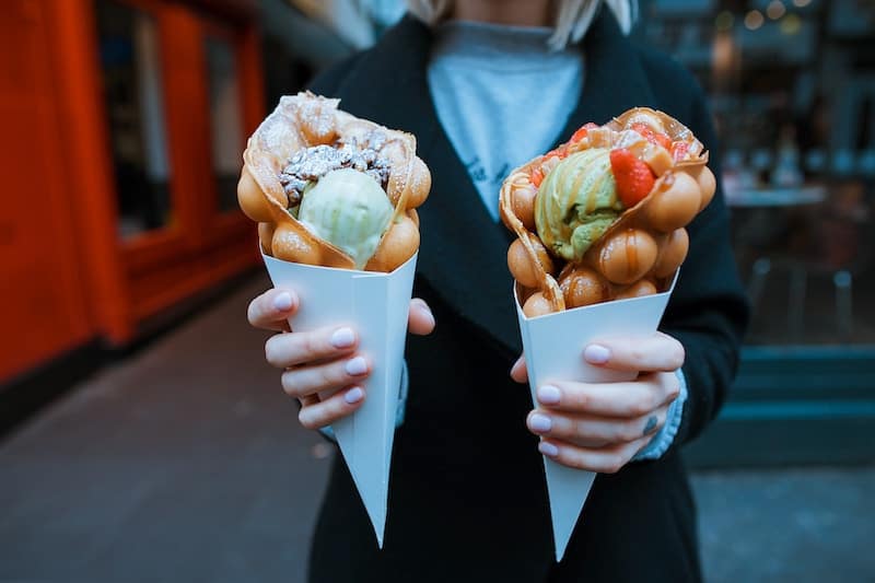 Ice cream cones with syrup on top