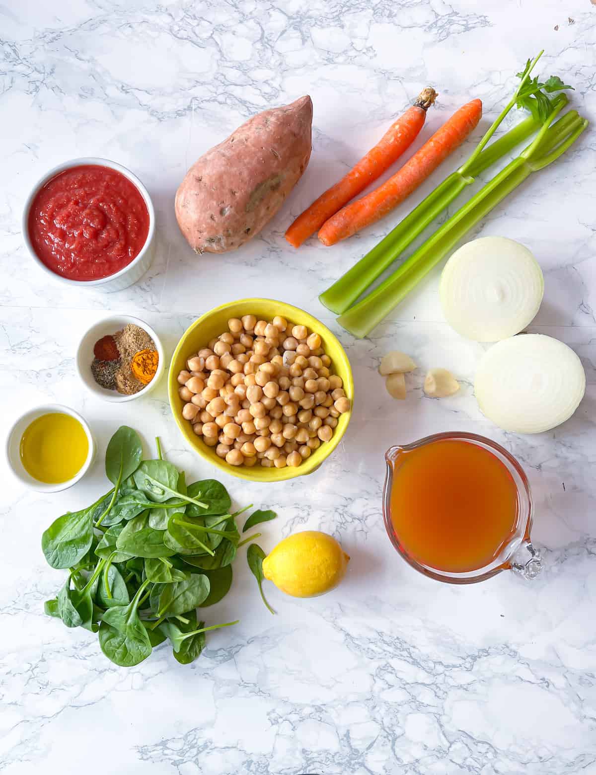 Ingredients for mediterranean chickpea soup on a marble table