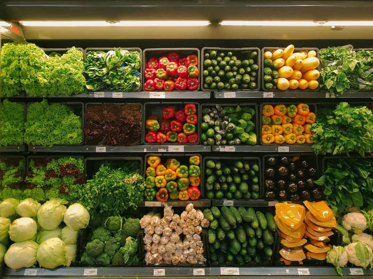 A lot of colorful vegetables in the produce section of the grocery store