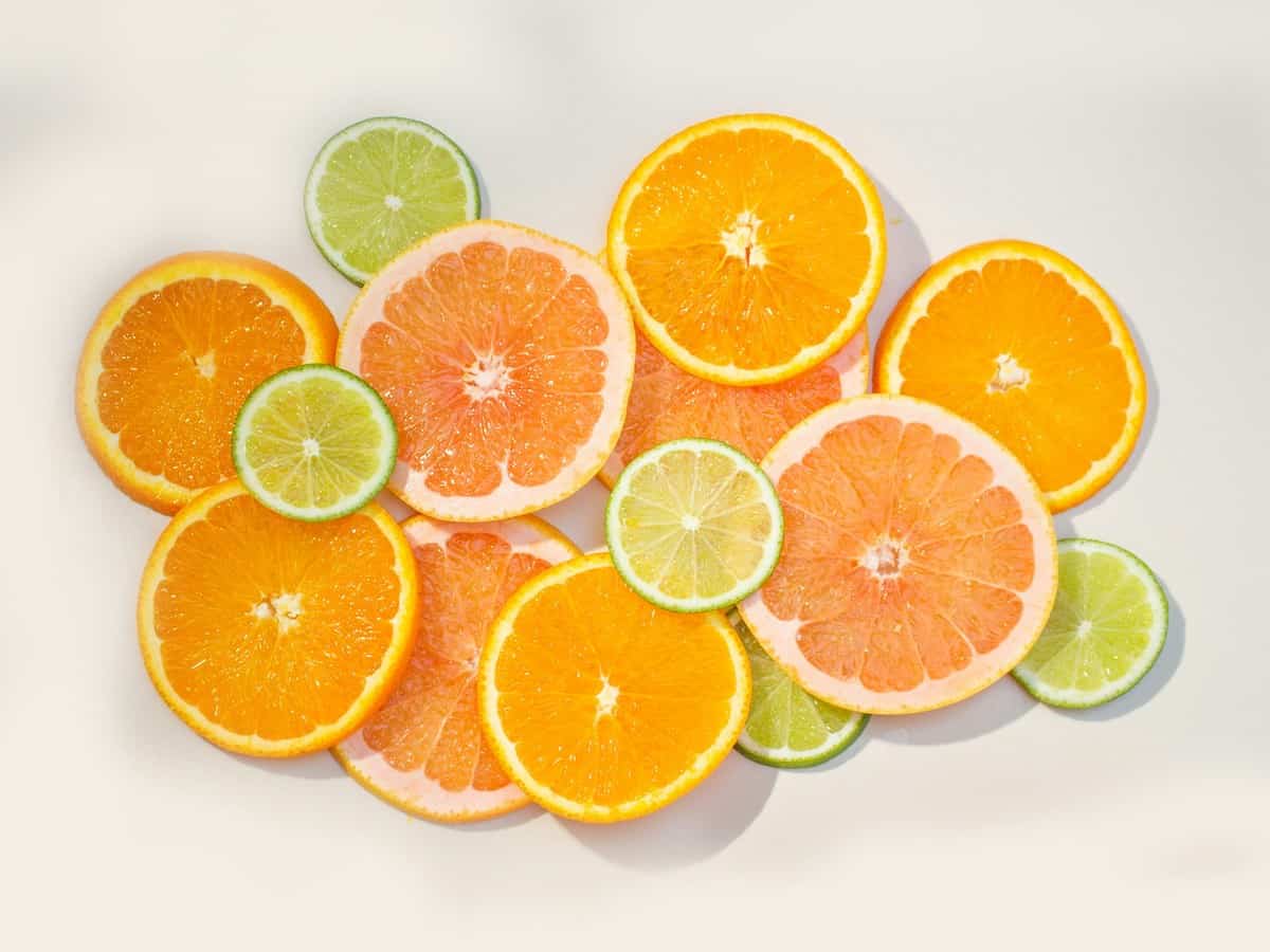 Different citrus fruits in slices
