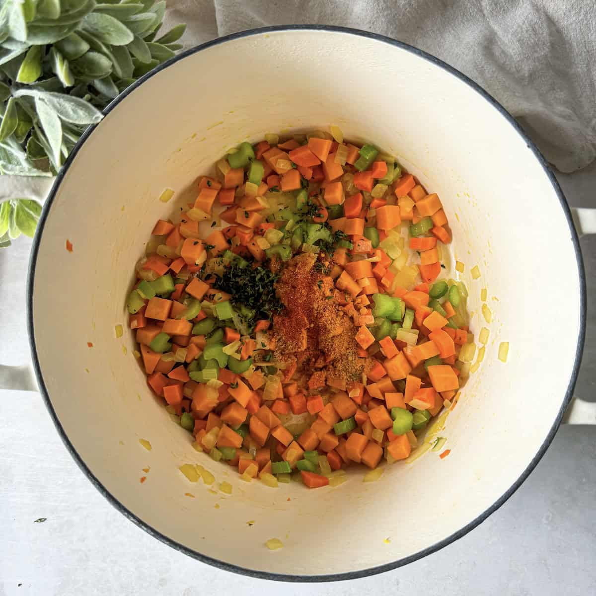 celery, carrots, onion added to a dutch oven.