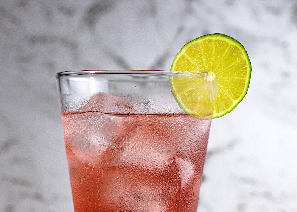 a mocktail with a slice of lime.