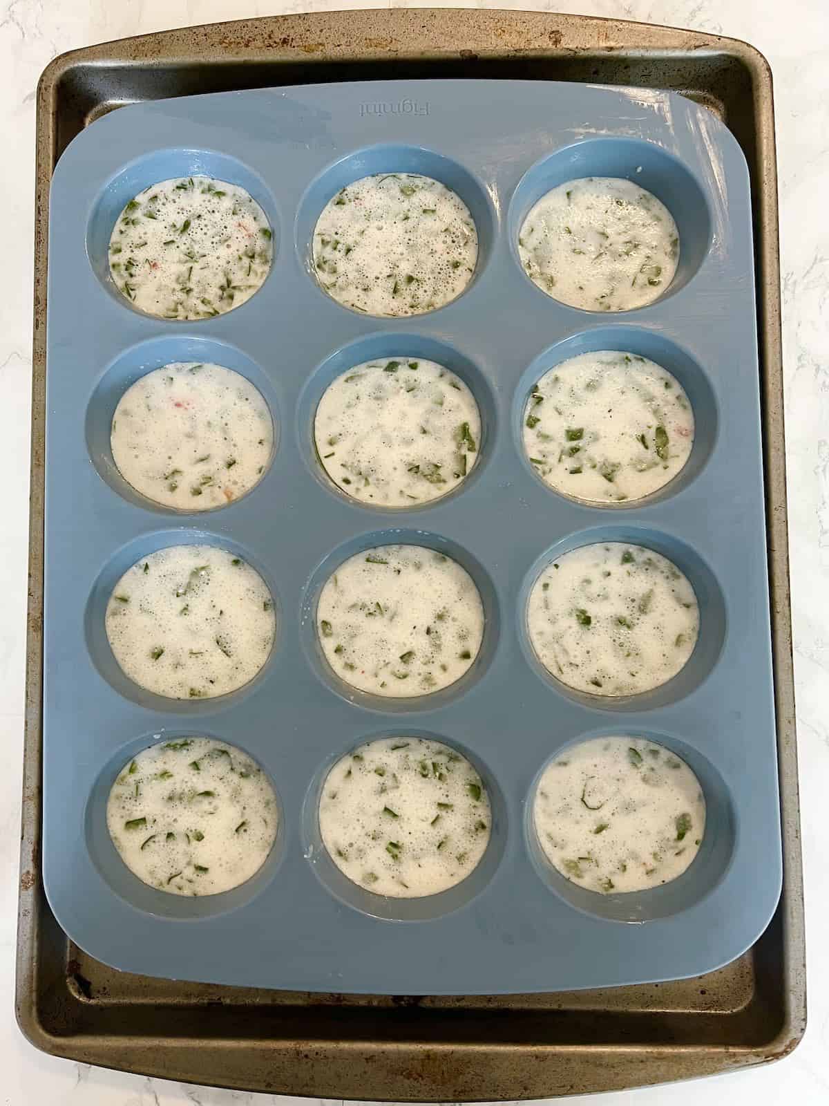 Starbucks egg white bites in a muffin pan before being cooked