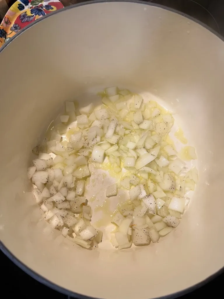 onions simmering in a pot 