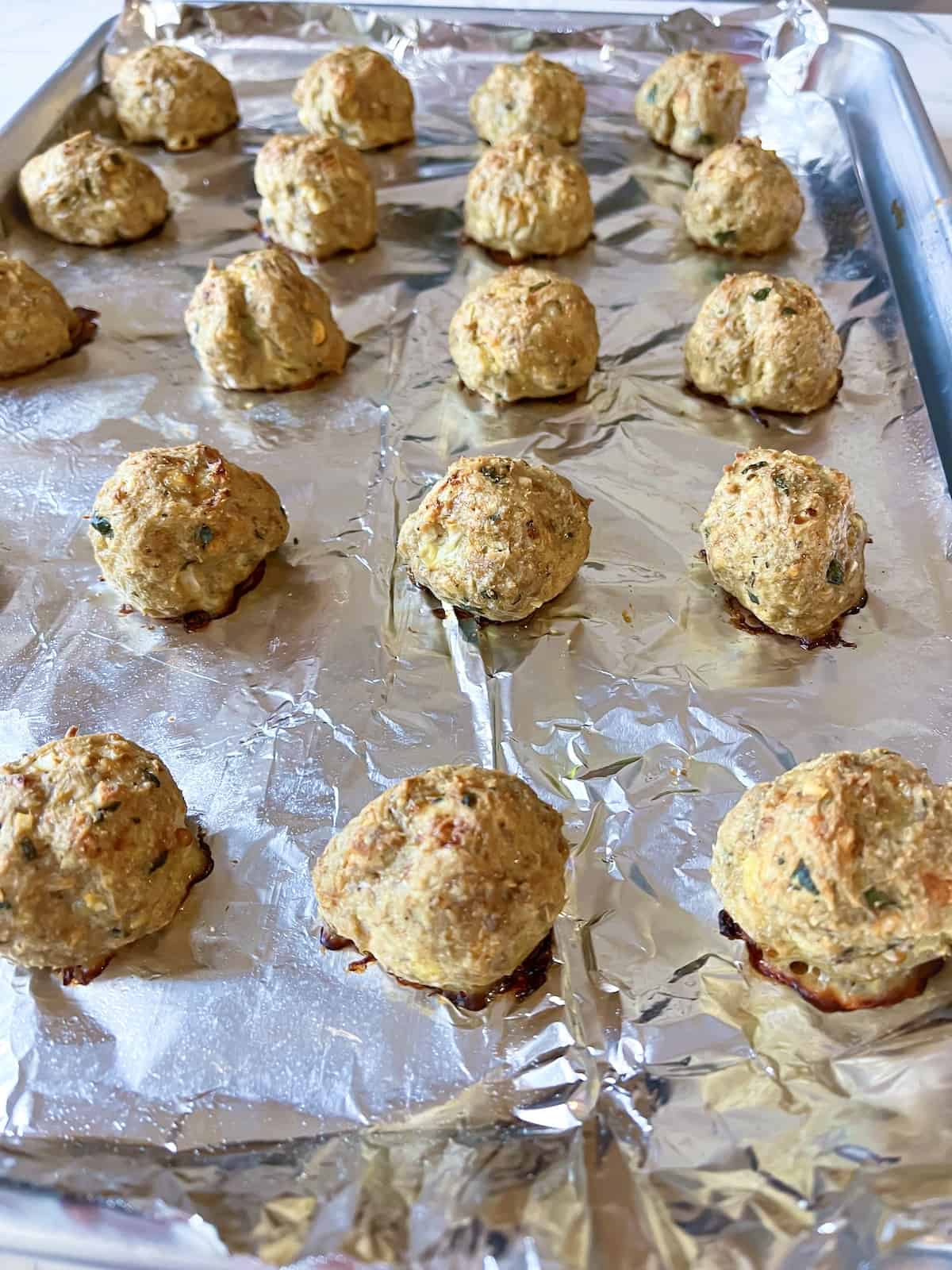 gluten-free turkey meatballs fresh out of the oven on a prepared baking sheet