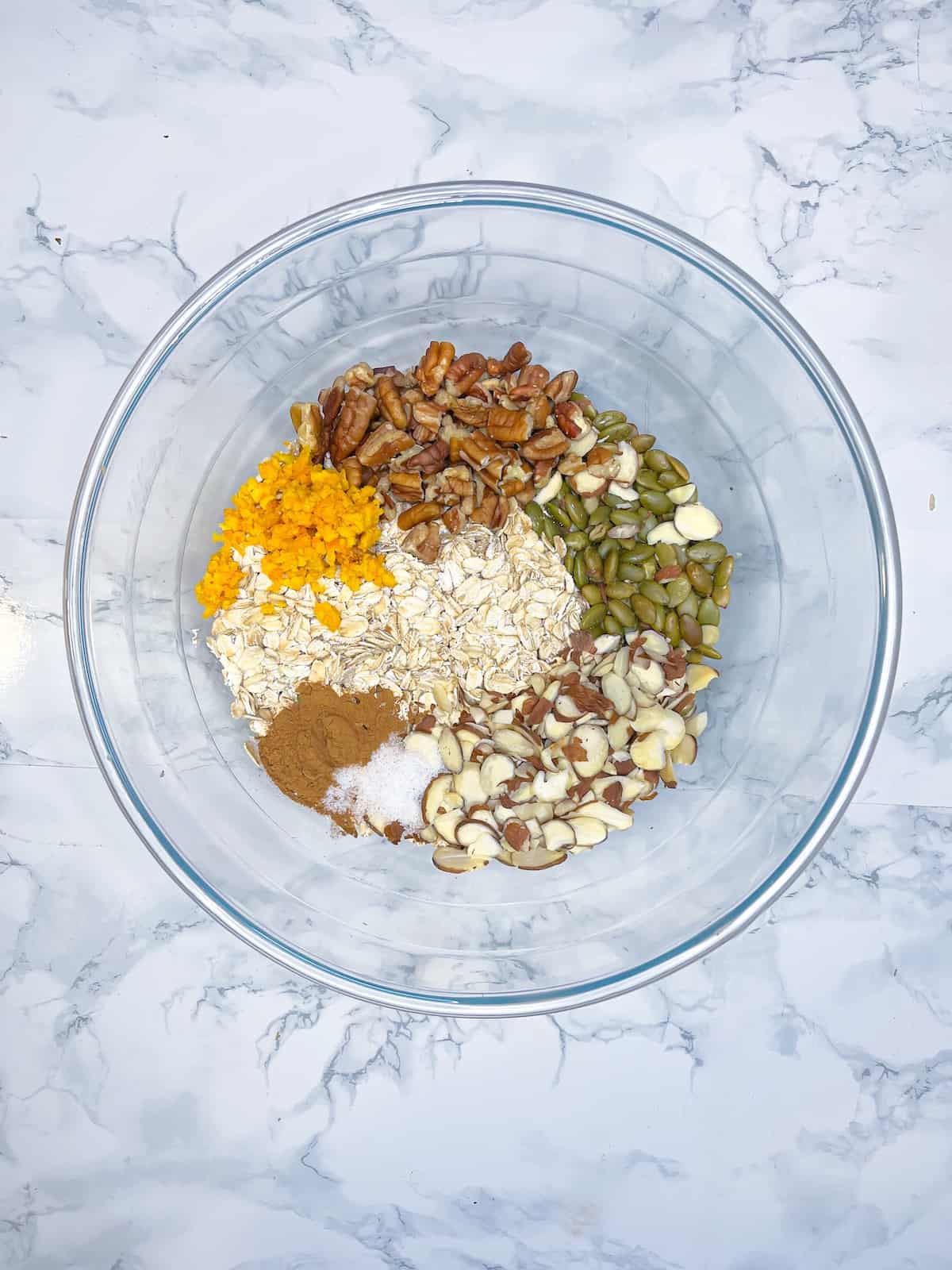 step 1 of orange granola: mix dry ingredients in a bowl