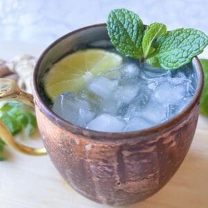 ginger beer mocktail (moscow mule mocktail) in a copper mug with ice cubes