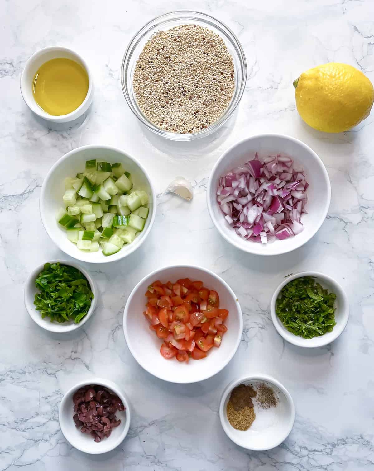 ingredients for quinoa salad in small bowls