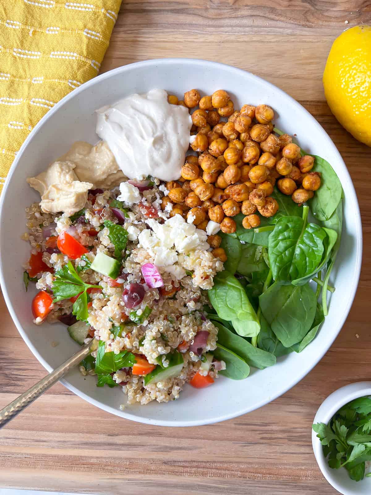 mediterranean grain bowl with roasted chickpeas and tahini dressing