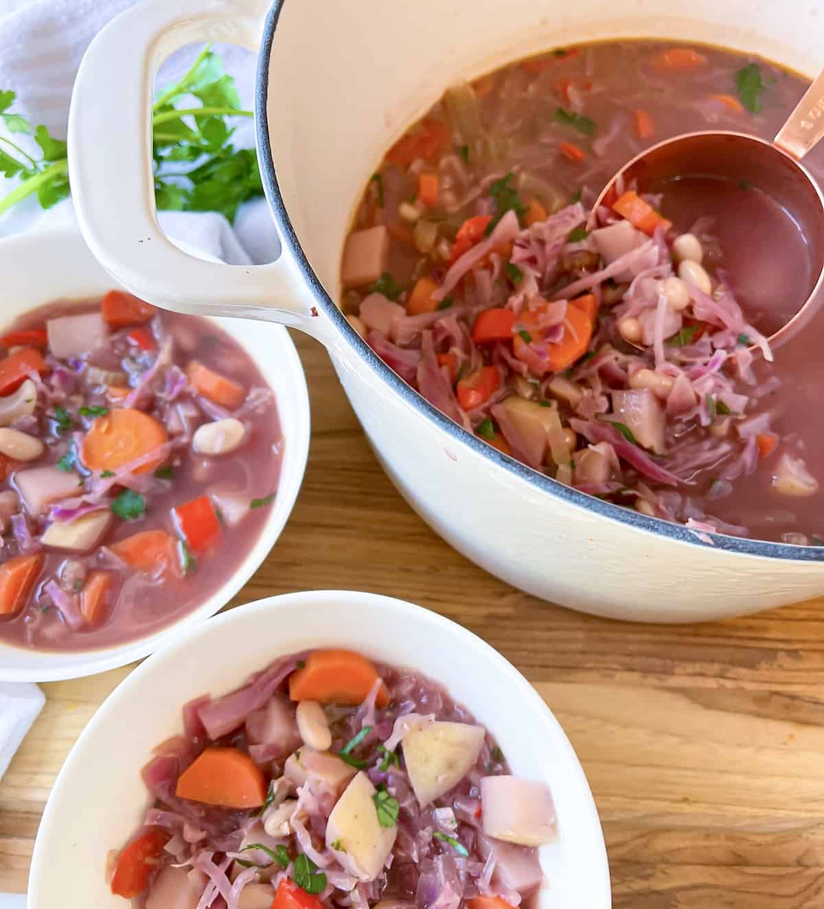 Red cabbage soup with a measuring cup