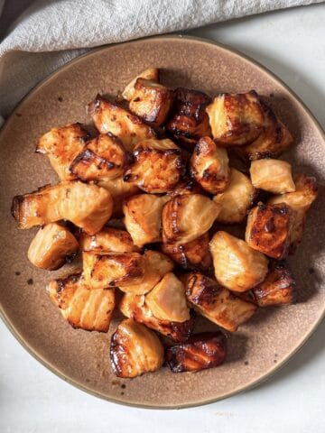 air fryer salmon bites on a plate overhead view.