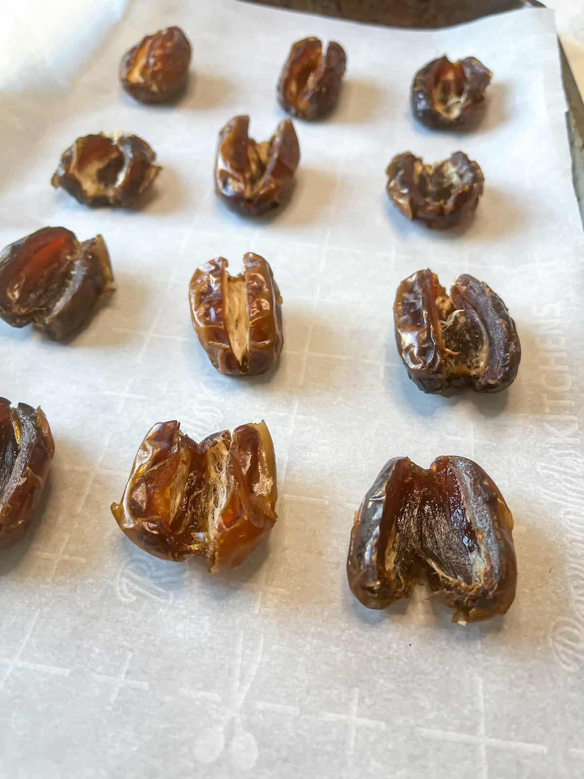 dates with the pits removed on a parchment paper
