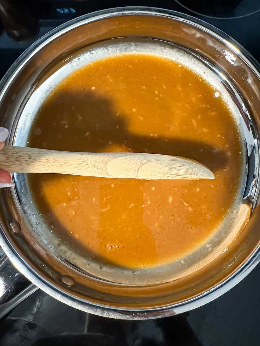 Honey garlic sauce in a skillet.