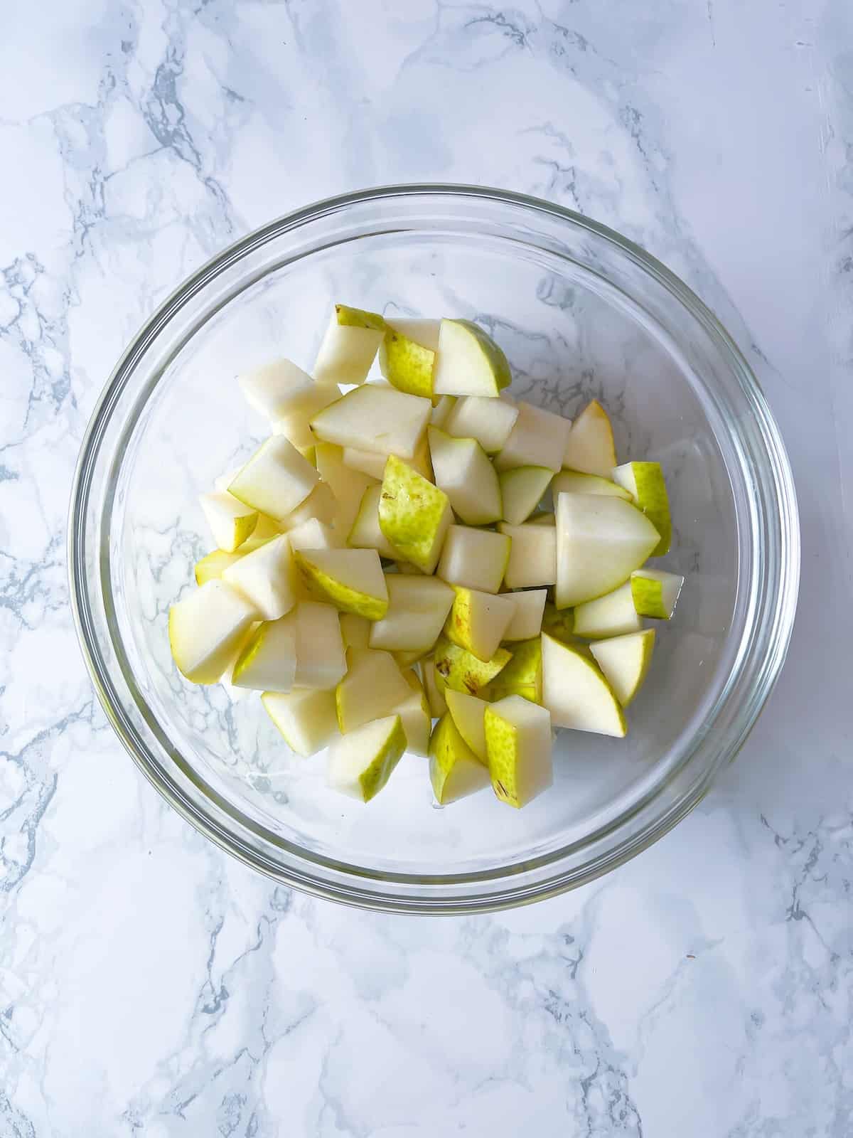 ripe pear diced in a glass bowl