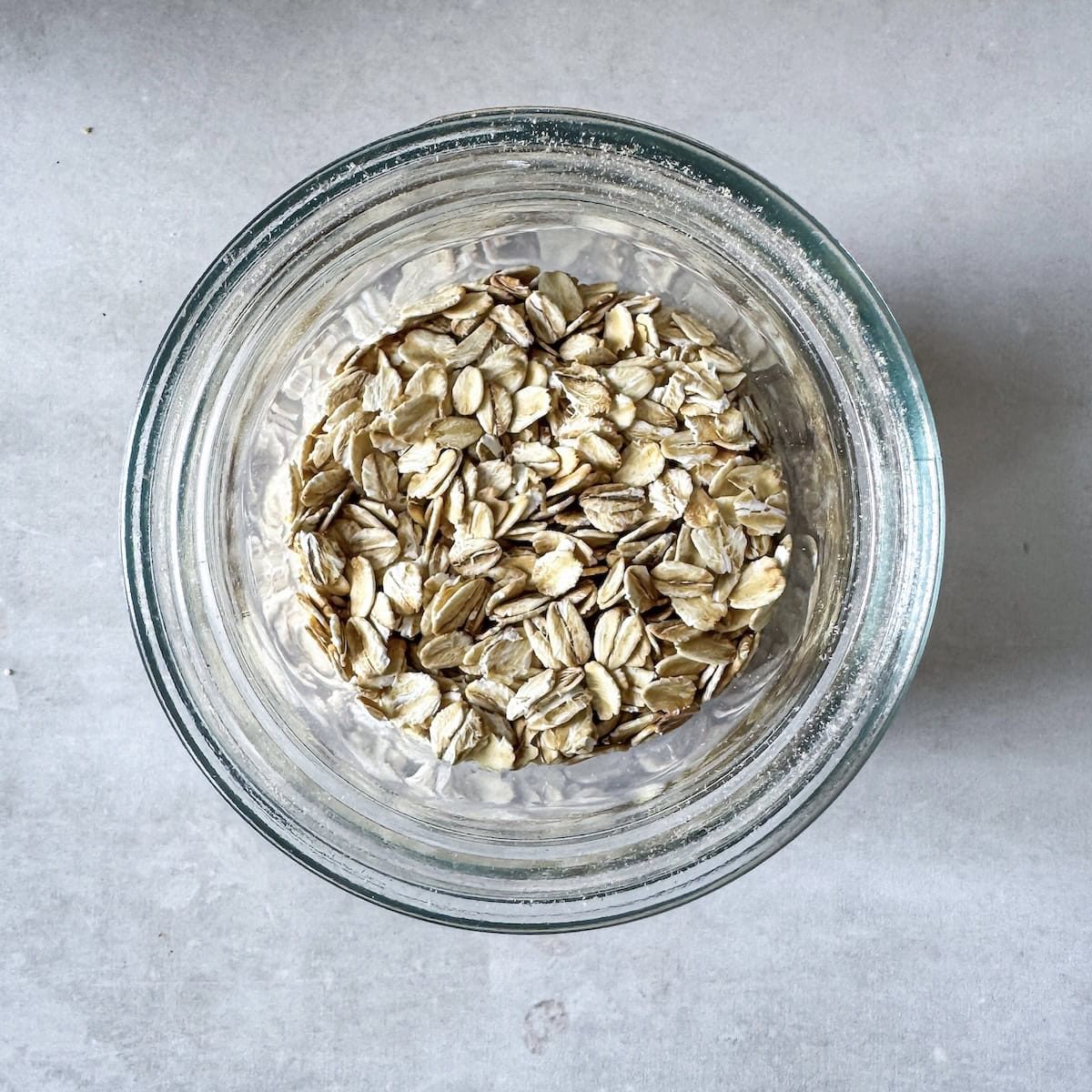 overhead view of oatmeal and chia seeds in a mason jar.
