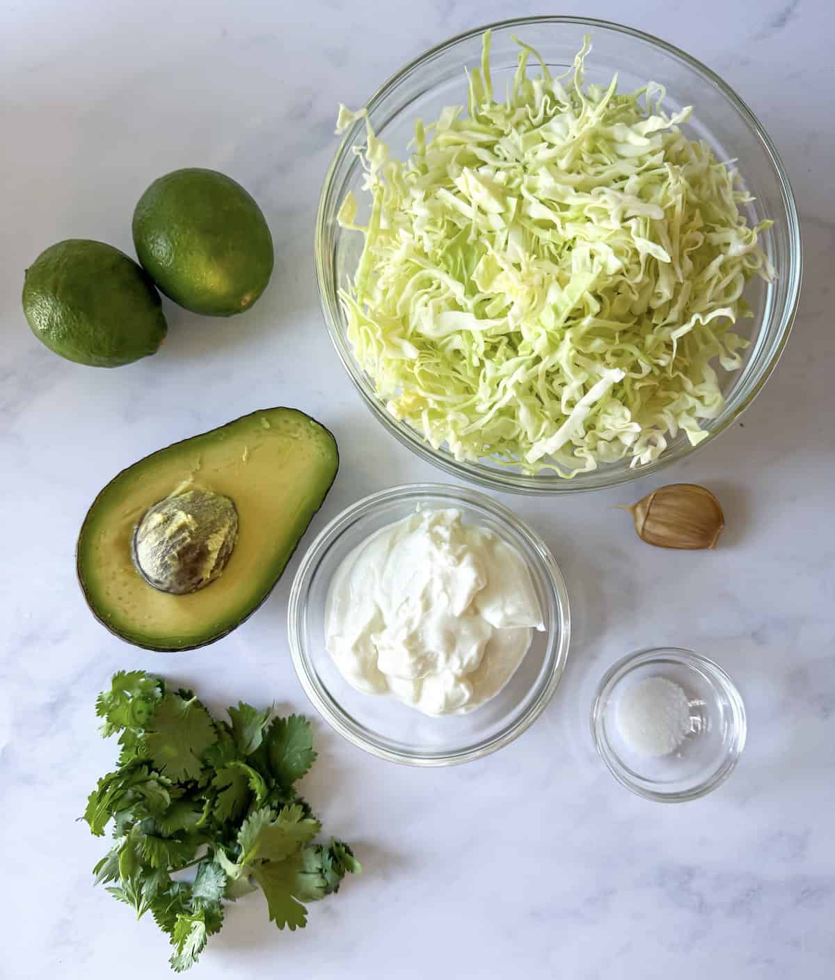 Ingredients to make avocado lime crema slaw.