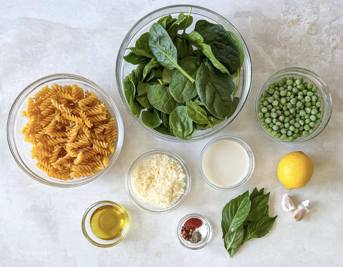 green pasta sauce ingredients on a table.