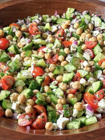 chickpea cucumber salad in a wooden bowl.