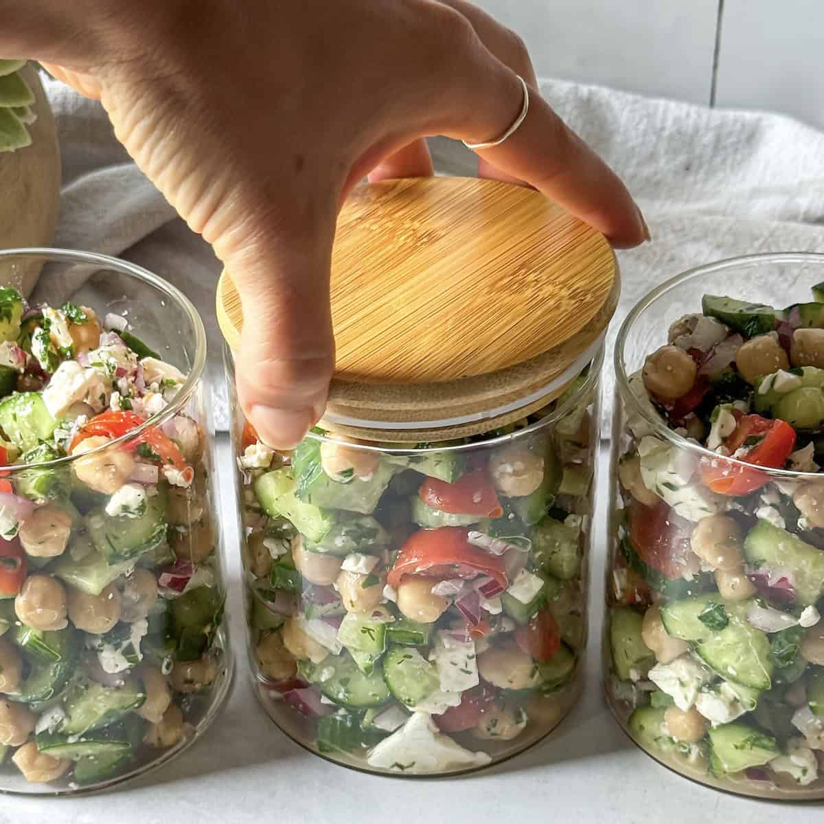 chickpea cucumber salad in meal prep containers.