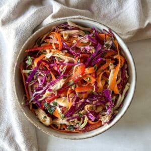 asian crunch salad in a bowl right before being served.