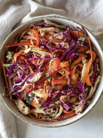 asian crunch salad in a bowl right before being served.