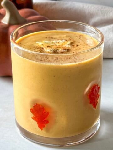 side view of pumpkin protein smoothie.