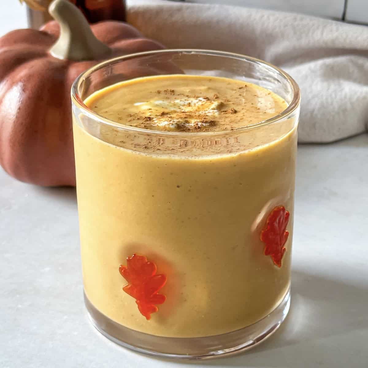 side view of pumpkin protein smoothie.
