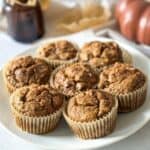 Pumpkin banana bread muffins on a plate.