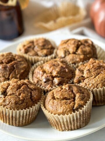 Pumpkin banana bread muffins on a plate.