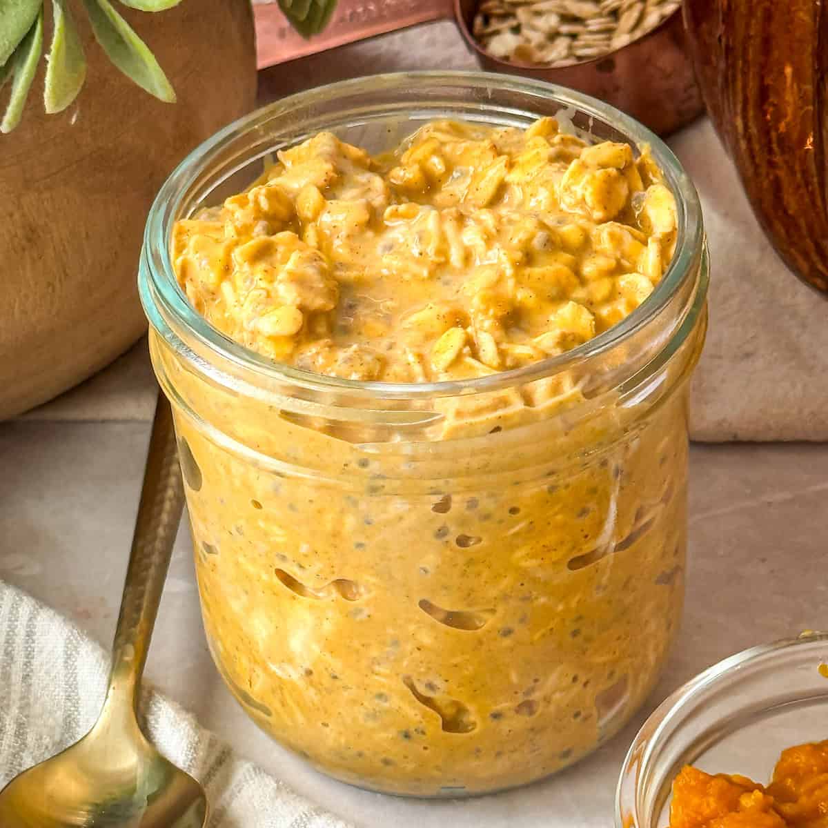 Pumpkin puree mixed with the other ingredients in pumpkin pie overnight oats.