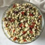 overhead view of tuscan chicken salad in a glass bowl