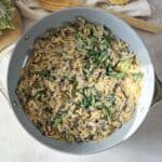 overhead view of mushroom orzo with spinach.