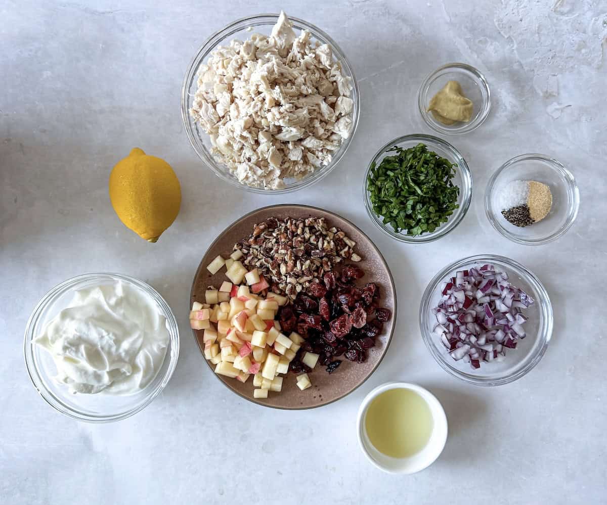ingredients for pecan cranberry chicken salad on a table.