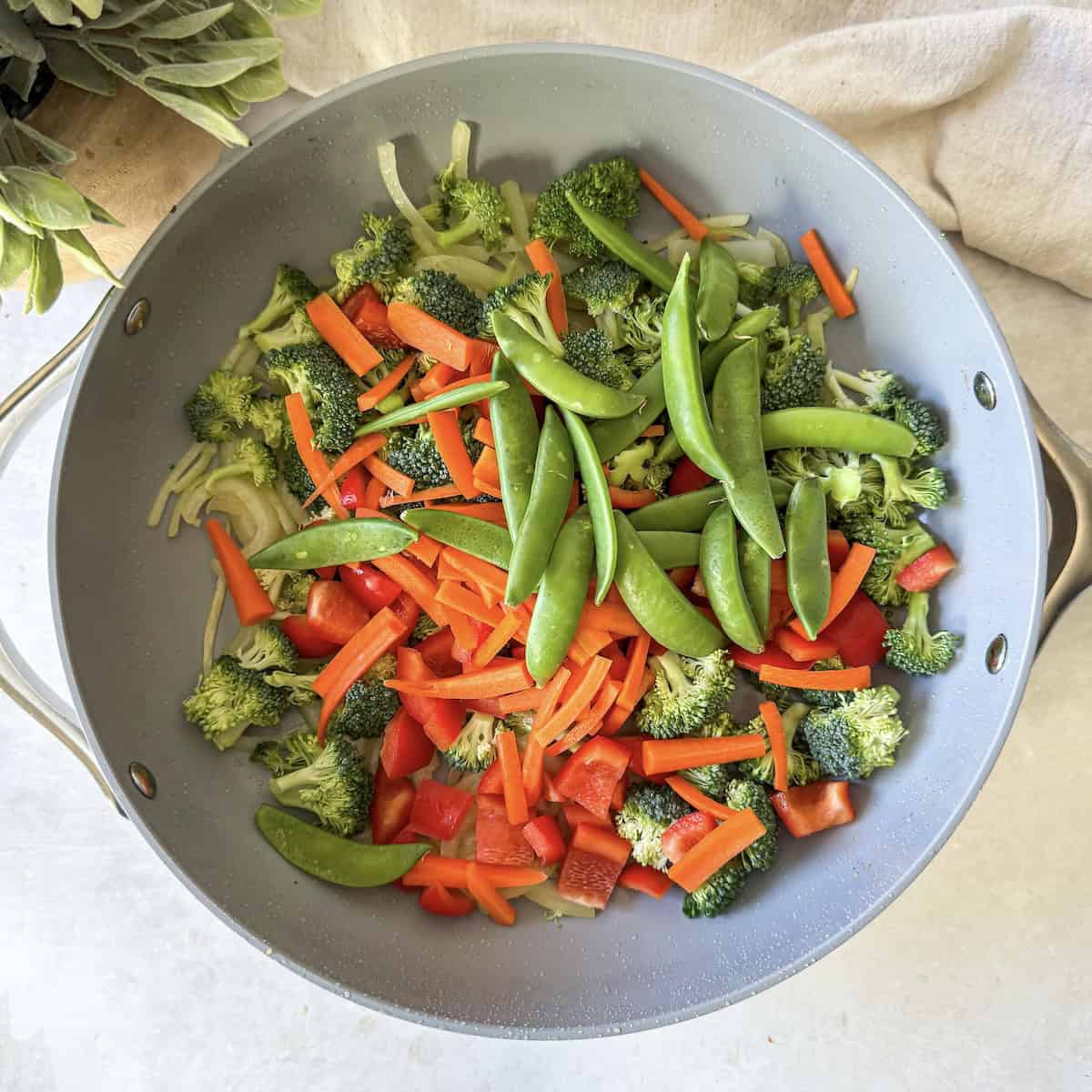 chopped veggies in a skillet.