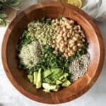 kale and white bean salad with dressing on top (overhead view)