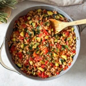 overhead view of turkey zucchini skillet with wooden spoon in it.