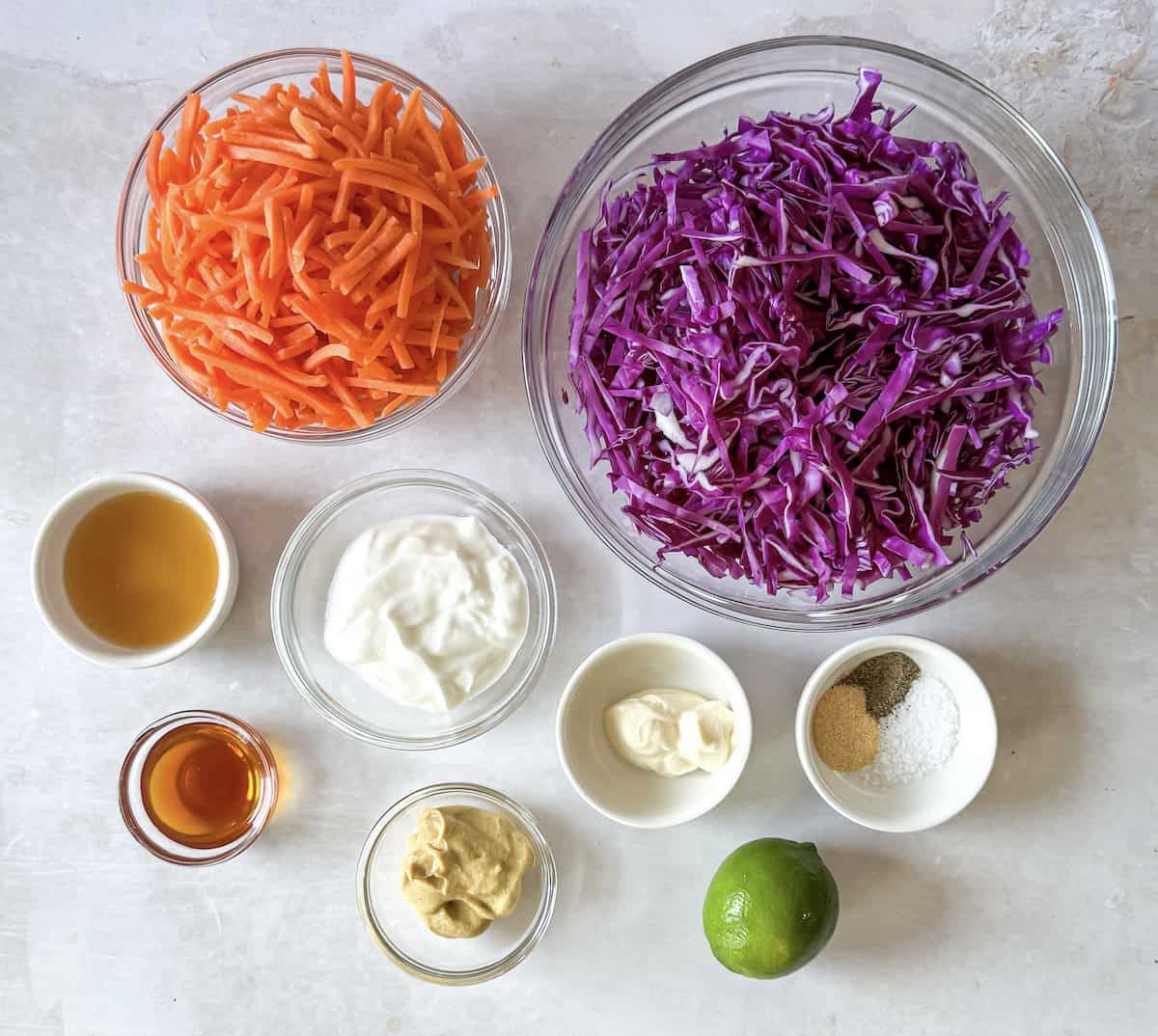 ingredients for purple cabbage coleslaw on a table.