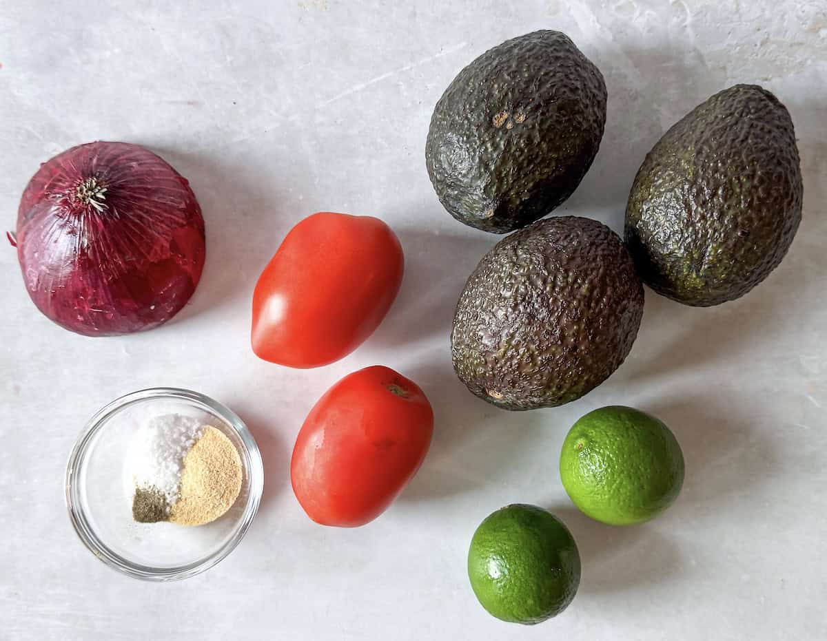 guacamole without cilantro ingredients on a table.