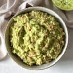 overhead view of homemade guacamole without cilantro in a bowl.