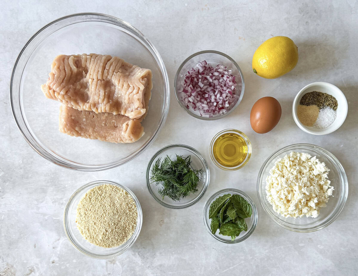 Greek chicken meatball bowl ingredients on a table.