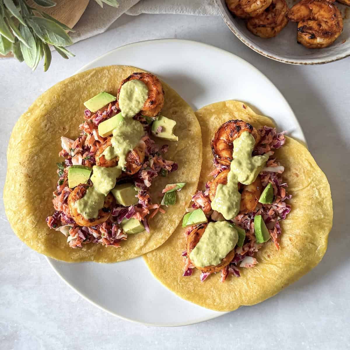 hot honey shrimp tacos on a plate - overhead view.