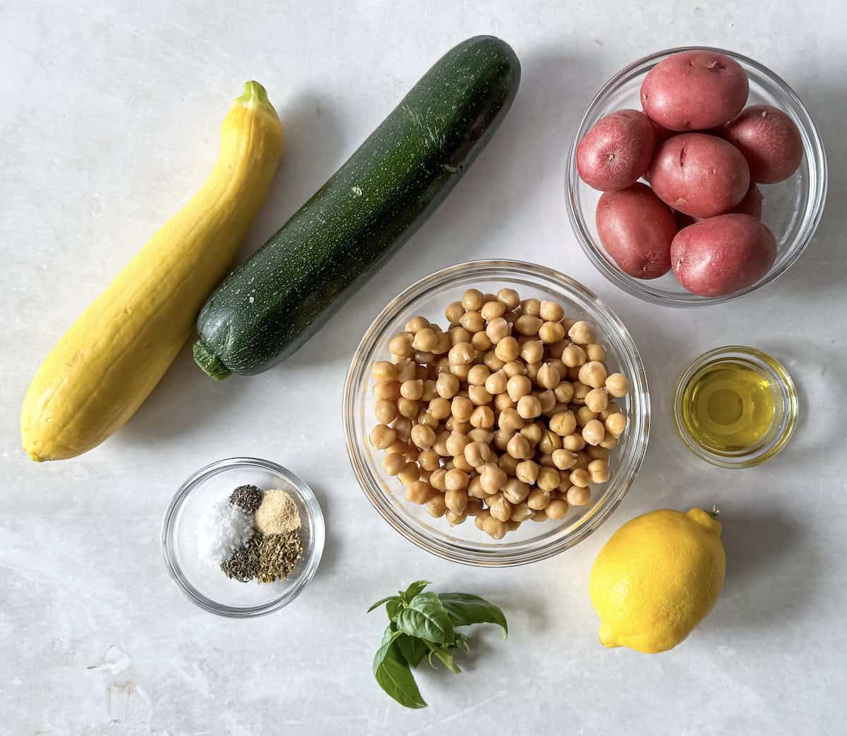 Ingredients for roasted zucchini salad on a table.