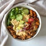 big mac burger bowl with special sauce, overhead view further away.