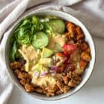big mac burger bowl with special sauce, overhead view without sauce in background.